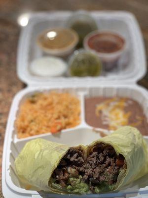 Carne Asada Burrito with rice and beans. Ordered to go tasted delicious'