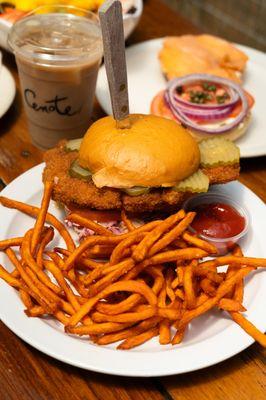 Fried Chicken Breast, House Made Hot Honey, Creamy Verde Mayo, Pickles, Tomato & Slaw on an Artisan Bun. Served with Fries