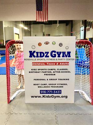 Our new signage for Roseville! Coco photo bombing it like a champ.