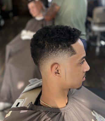 BALD MID FADE WITH POINT SIDEBURNS