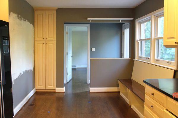 This is the opposite end of the kitchen, knee wall taken down and countertops replaced the bench shown