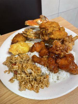 Plate of goodies- fried Blue Crab in the background