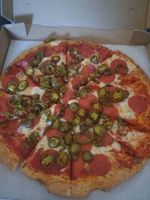 Large jalapeño and pepperoni pizza.
