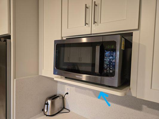 Custom built microwave shelf.