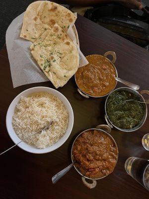 Butter chicken masala saag and rice and garlic naan.