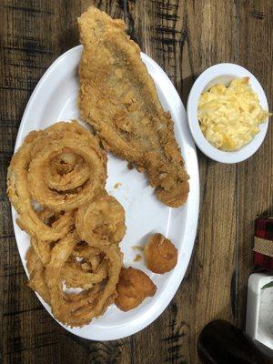 Catfish platter with onion rings, hush puppies and Mac & cheese.