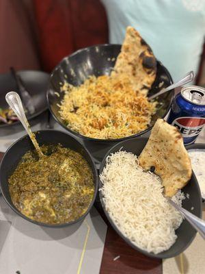 Lamb saag, special chicken, rice **Some bites may have been taken before the photo **