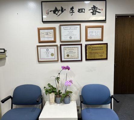 On the wall, there are: National and California Acupuncture License certificates, and technical qualifications in the acupuncture industry i