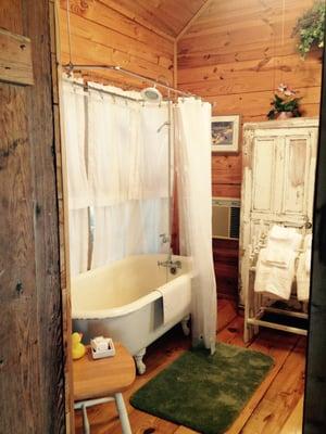 Large bathroom with claw foot tub/shower. Shower is not a puny water saver, great pressure.