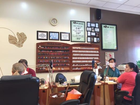 Price list shown on right and finger nail colors below. I saw OPI nail colors and some other ones, but didn't recognize the brand.