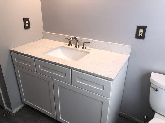 Toilet, Vanity, countertop, sink, faucet, trap and valves installed