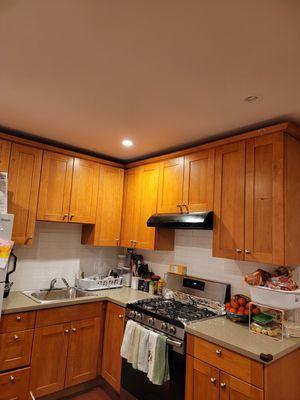 Kitchen cabinets, stove, countertops, organizing.