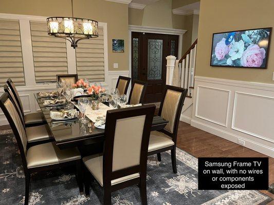 Samsung frame TV installed on wall with no wires or components exposed. A big hit for entertaining