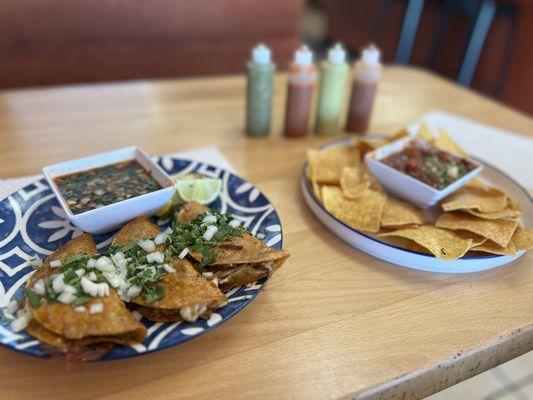 Birria tacos and chips and salsa. Birria ramen is also delicious here!