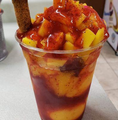 Mexican fruit cup with chamoy sauce and either Tajin or chili powder. Pretty tasty .