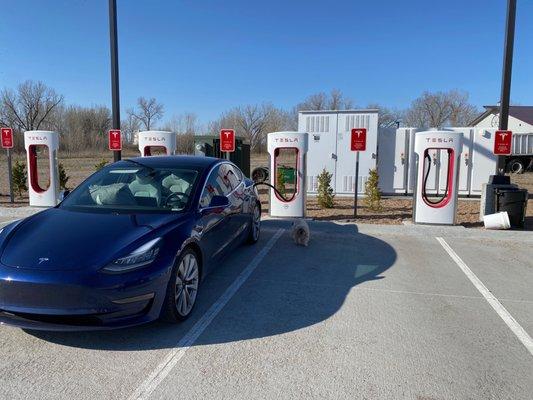 Gothenburg, Nebraska tesla supercharging station behind the comfort suites