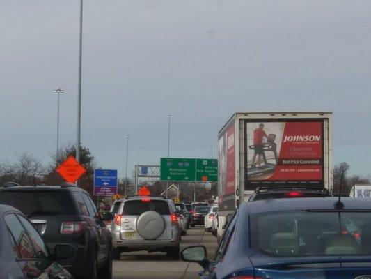 Several lanes of traffic all being forced to merge into one lane. Great fun on a holiday weekend!!