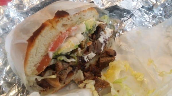 Lengua torta - toasted brioche-y bolillo, blk bean, quesillo, tender & crisped lengua, crema, avocado, LTO, pickled jalapenos