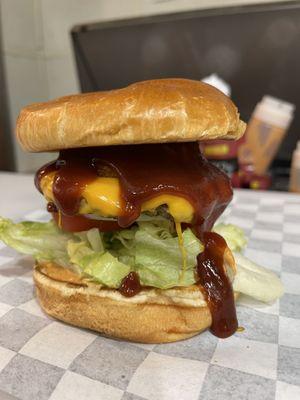 Bulls Eye Burger drizzled with BBQ sauce!