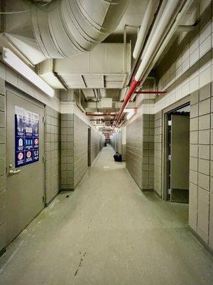 Hallway leading to bathroom/locker rooms