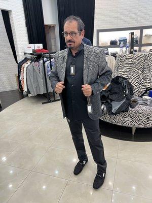 A complete outfit with pants, shoes, shirt, and dinner jacket