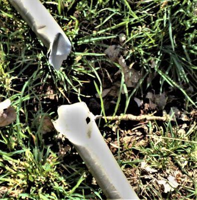 Broken pipe showing deep hole created by fallen tree