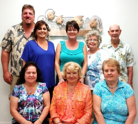 The staff of Aqua Seas Realty pictured above are on the first row, left to right, JoAnn Fraidenburg, Patrina ?Pat?...