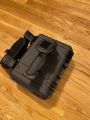 An X-ray Fluorescence (XRF) device is used to detect lead-based paint levels within a surface.