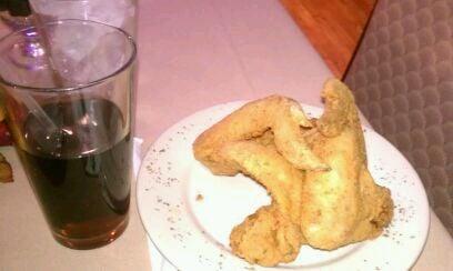 Uptown drink with side of chicken wings