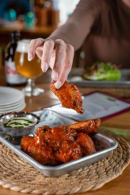 Boathouse wings with Fresno hot sauce at The Boathouse at Silver Sands in Greenport -- spicy, coastal bar fare on Long Island's North Fork.