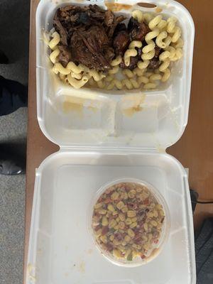 Brisket and Pork Belly Burnt ends with sides of Mac-N-Cheese and Street corn