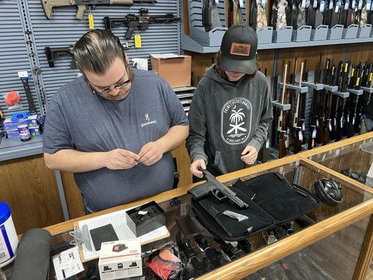 After purchasing the optic, they mounted it on the gun and sighted it in. (no charge)