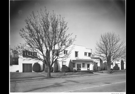 Piper Funeral Home Inc. circa 1952. The building was erected in 1938. The brick veneer on the two-story building has been painted white.