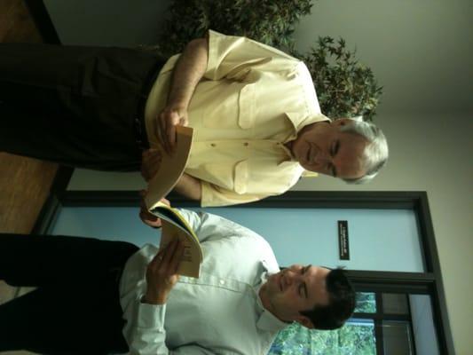 Dr Tempest and Hudson review a patients chart.