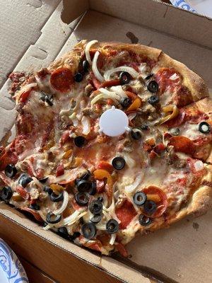 All toppings slid off the pizza, it was handed to us like this by the pizza shop.