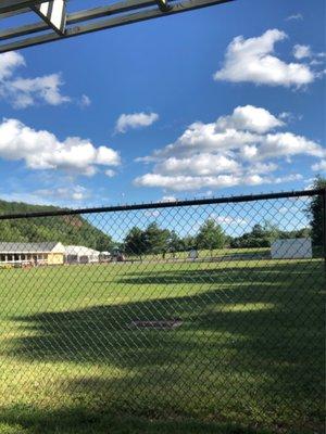 View of the field and cabin/tent