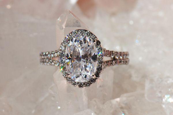 Oval diamond engagement ring set in a halo, one of a kind