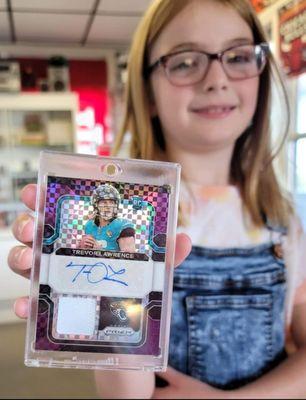 Peyton pulled Trevor Lawrence Prizm Autograph Patch here with her Dad.