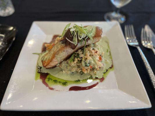 Salmon over lobster risotto.
