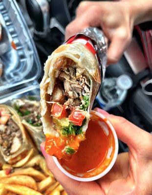 Chicken shawarma wrap with a side of hot sauce ;).