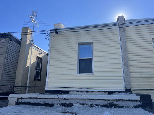 New heritage, cream vinyl siding installed!
