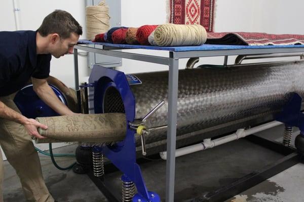 Rug centrifuge rinses residue and gets rugs 90% dry in 3 minutes!