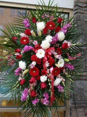 Elegant Sympathy Tribute featuring Premium Roses, Fragrant Stock, Elegant Lilies, Full Gerber Daisies and More