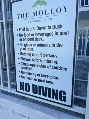 Pool area sign with rules that were not enforced.