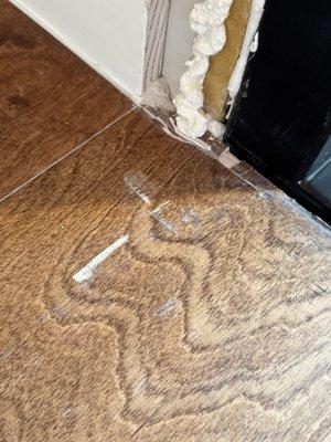 Wood floor damage and trim and drywall work left unfinished