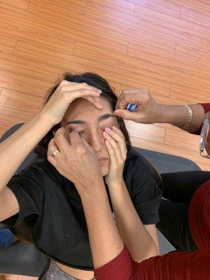 Daughter getting her brows on!