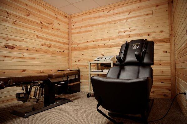 Adjusting and therapy room with interferential, ultrasound, decompression, and cold laser therapy