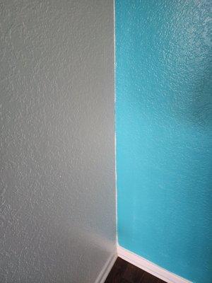 This is the accent wall they started. I truly love the color, (which I provided) but the small details have not been addressed.