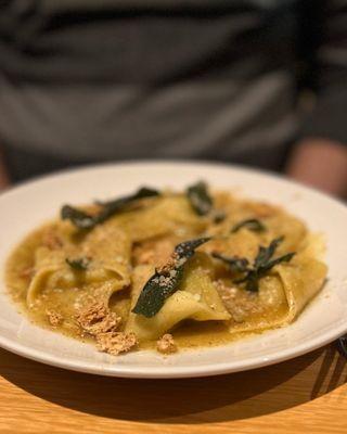 Cappellacci with sage, browned butter, and amaretto cookies.