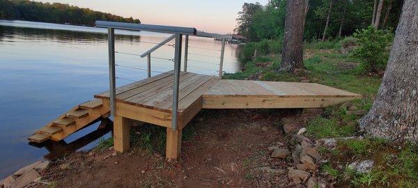 Small stairs with handrail and cable railing